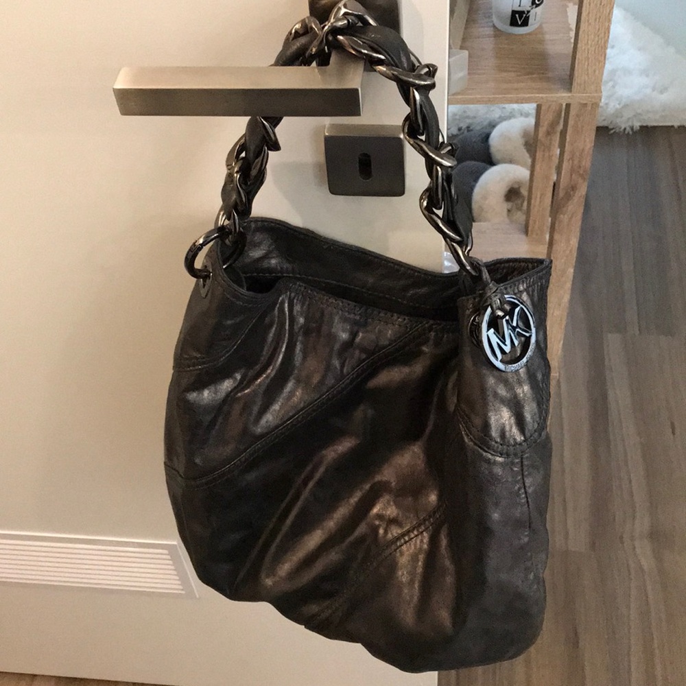 A dark grey/silver Michael Kors bag